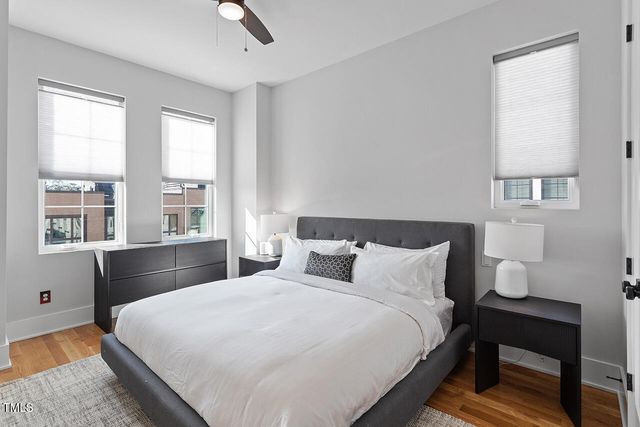 a large white bed in a white room