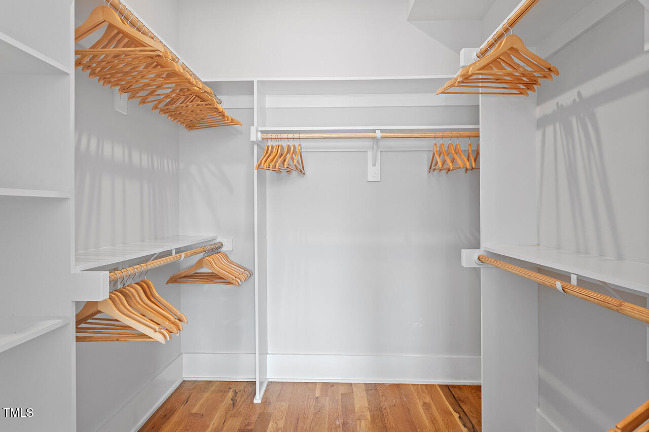 613 South West Street Raleigh, NC 27601 - Photo 26 of 36 a view of walk in closet with clothes