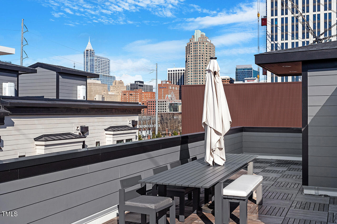 613 South West Street Raleigh, NC 27601 - Photo 35 of 36 a view of dinning table and chairs in patio