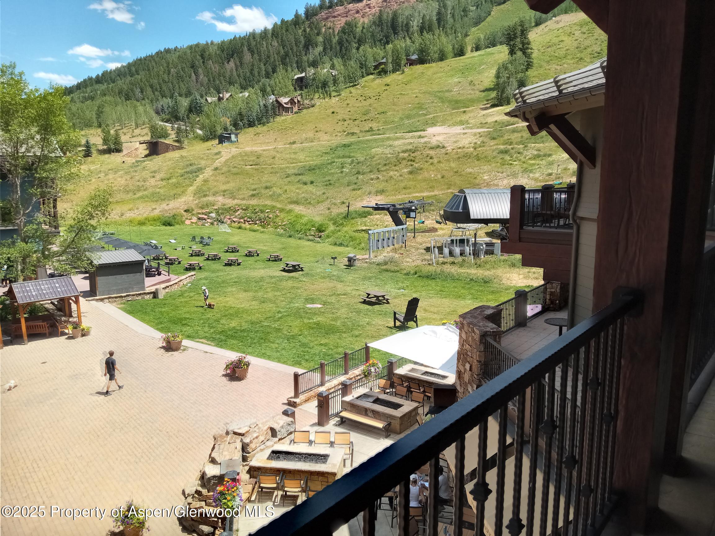 39 Boomerang Road, Unit 8209 SUMMER INTEREST 9 Aspen, CO 81611 - Photo 14 of 26 a view of swimming pool from a balcony