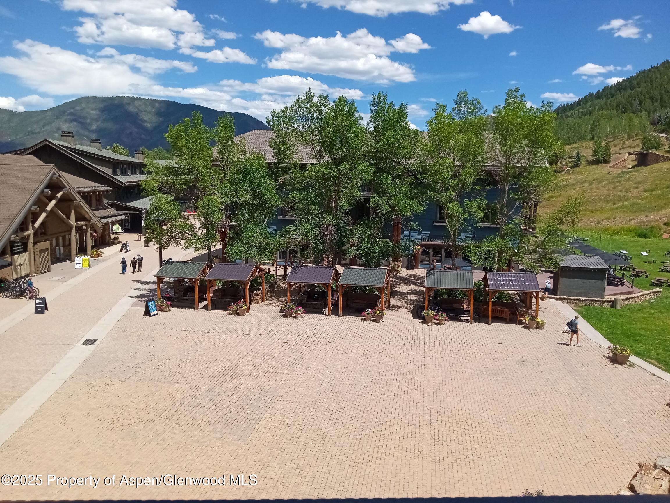 39 Boomerang Road, Unit 8209 SUMMER INTEREST 9 Aspen, CO 81611 - Photo 15 of 26 a view of a terrace with lawn chairs