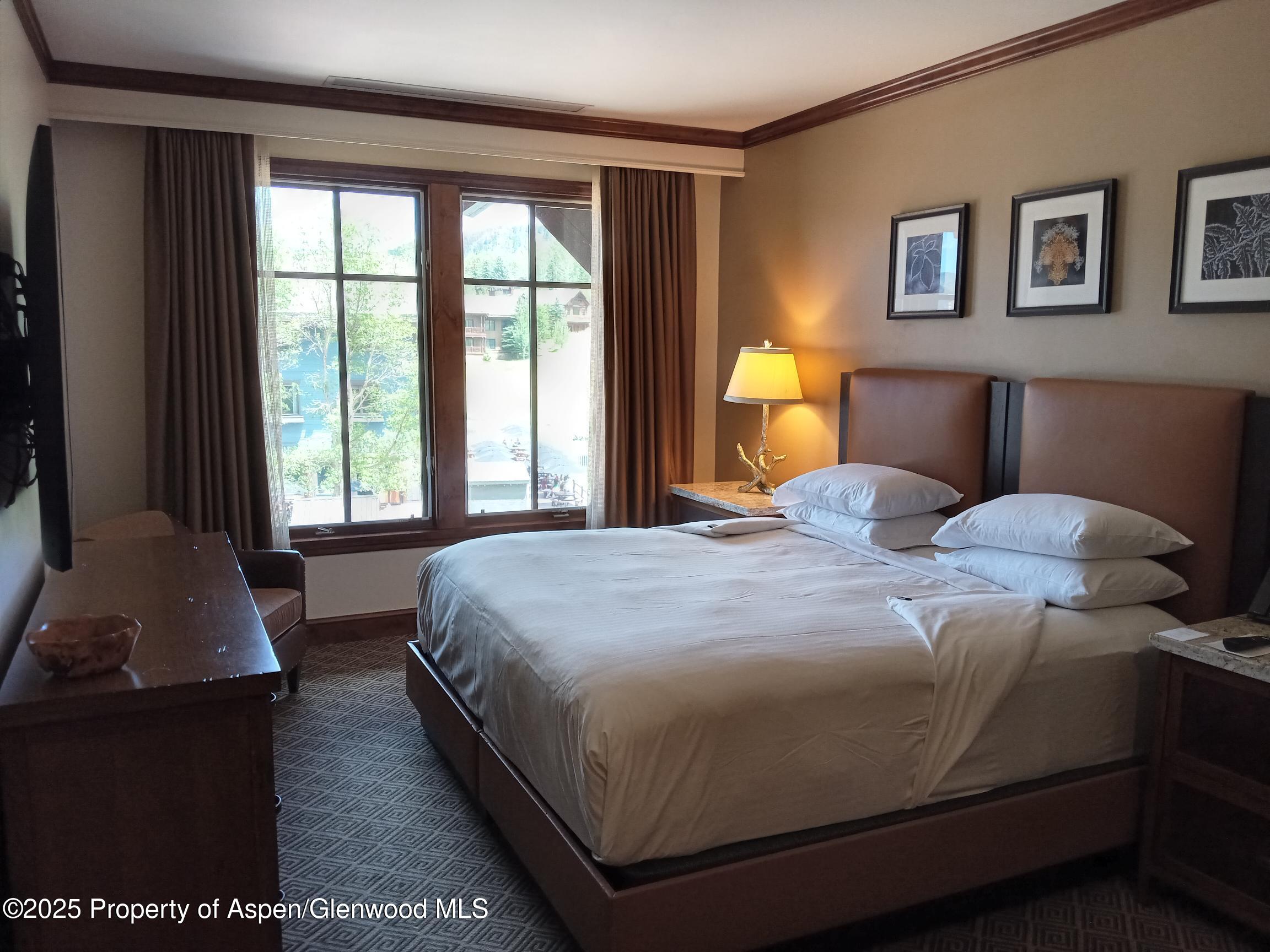 39 Boomerang Road, Unit 8209 SUMMER INTEREST 9 Aspen, CO 81611 - Photo 20 of 26 a bedroom with a bed and window
