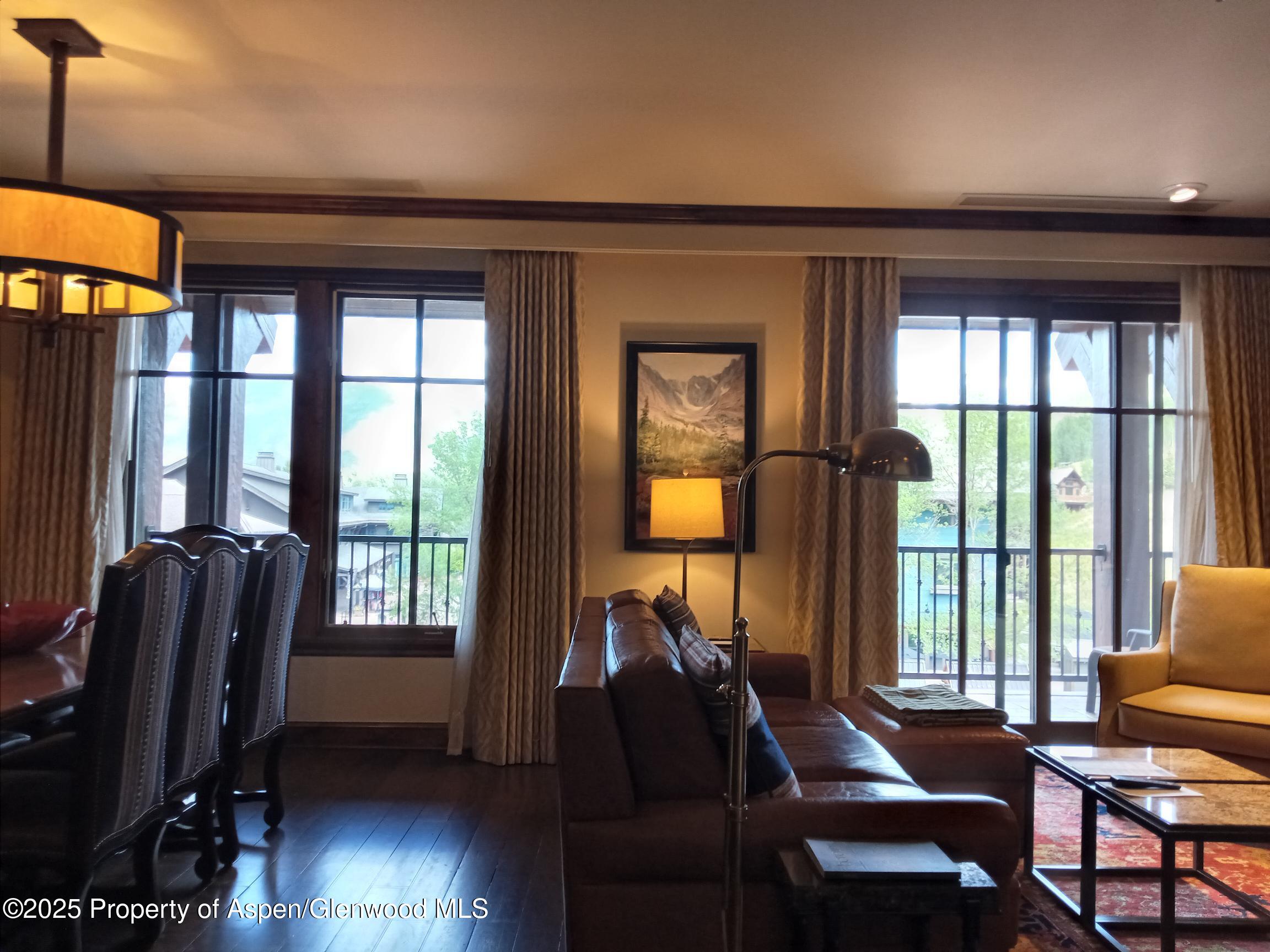 39 Boomerang Road, Unit 8209 SUMMER INTEREST 9 Aspen, CO 81611 - Photo 24 of 26 a living room with furniture and a window