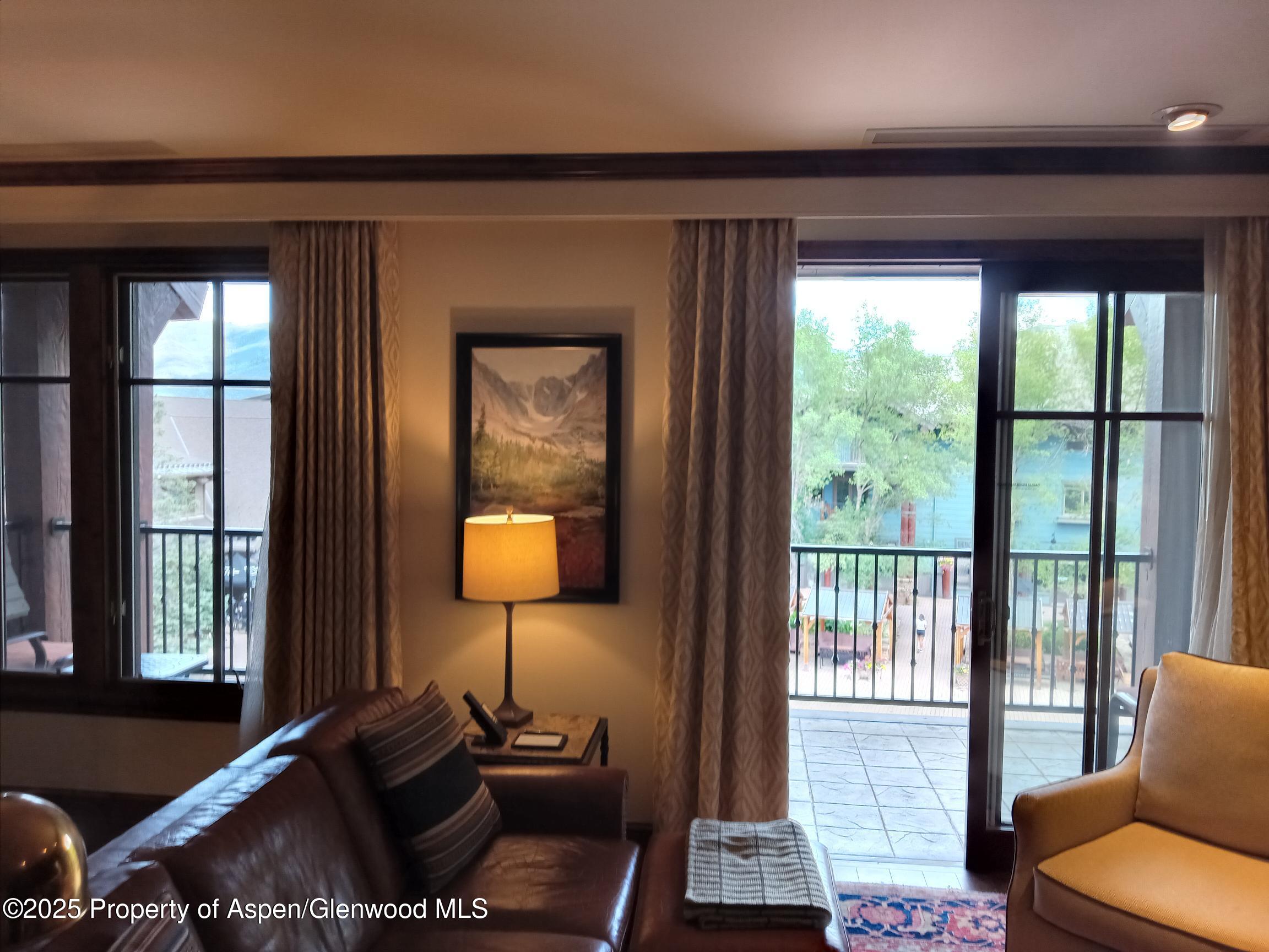 39 Boomerang Road, Unit 8209 SUMMER INTEREST 9 Aspen, CO 81611 - Photo 25 of 26 a living room with furniture and a window
