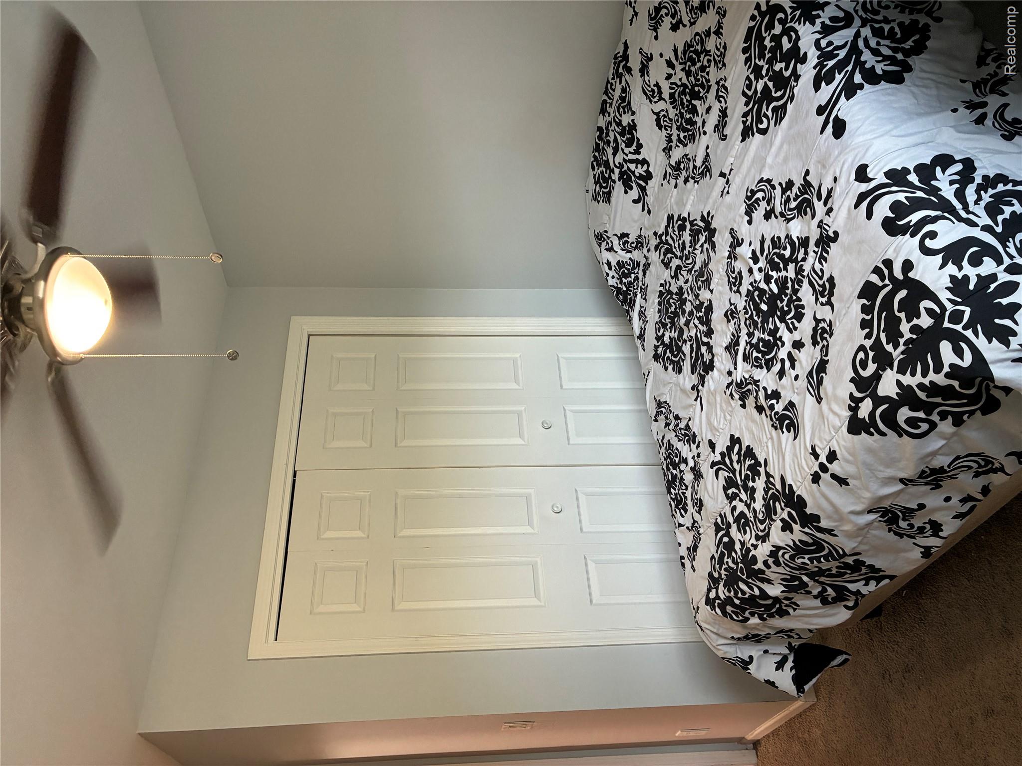10995 East Isabella County Line Road Coleman, MI 48618 - Photo 21 of 76 Recessed bi-fold closet doors with round hardware, overhead ceiling fan with integrated lighting