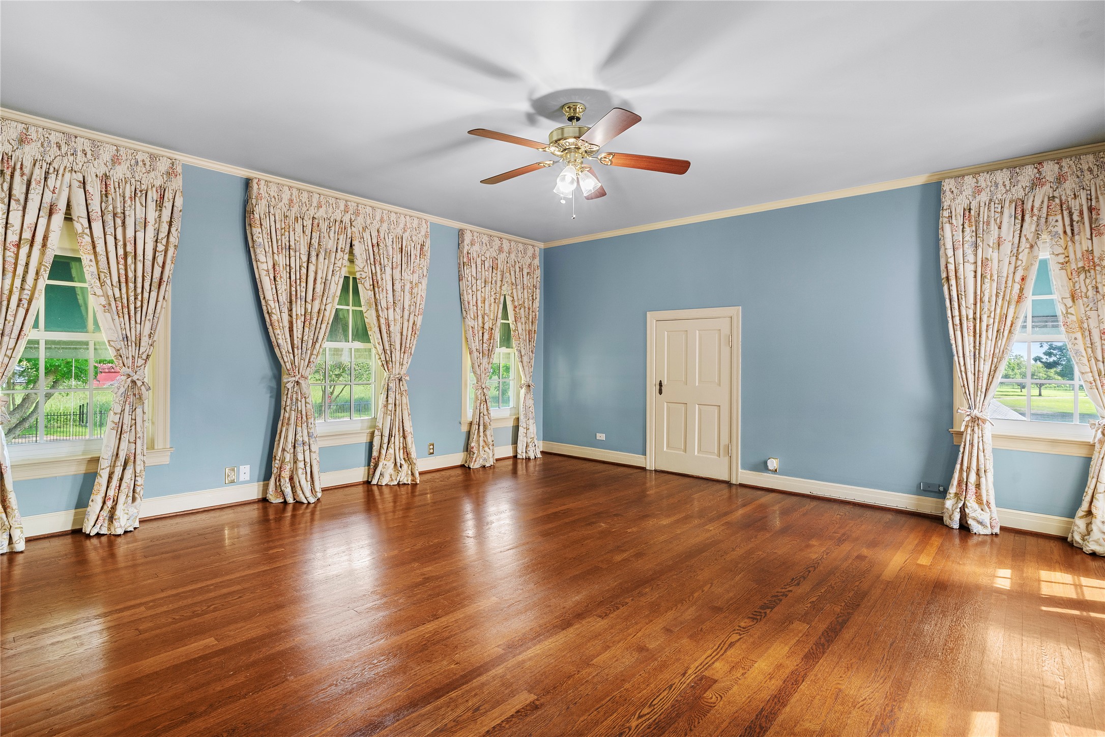 9827 FM 2759 Road Richmond, TX 77469 - Photo 31 of 50 a view of an empty room with wooden floor and a window
