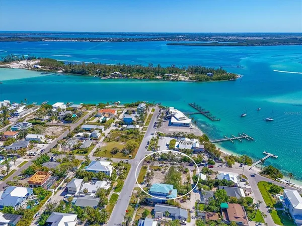 a view of an ocean and houses