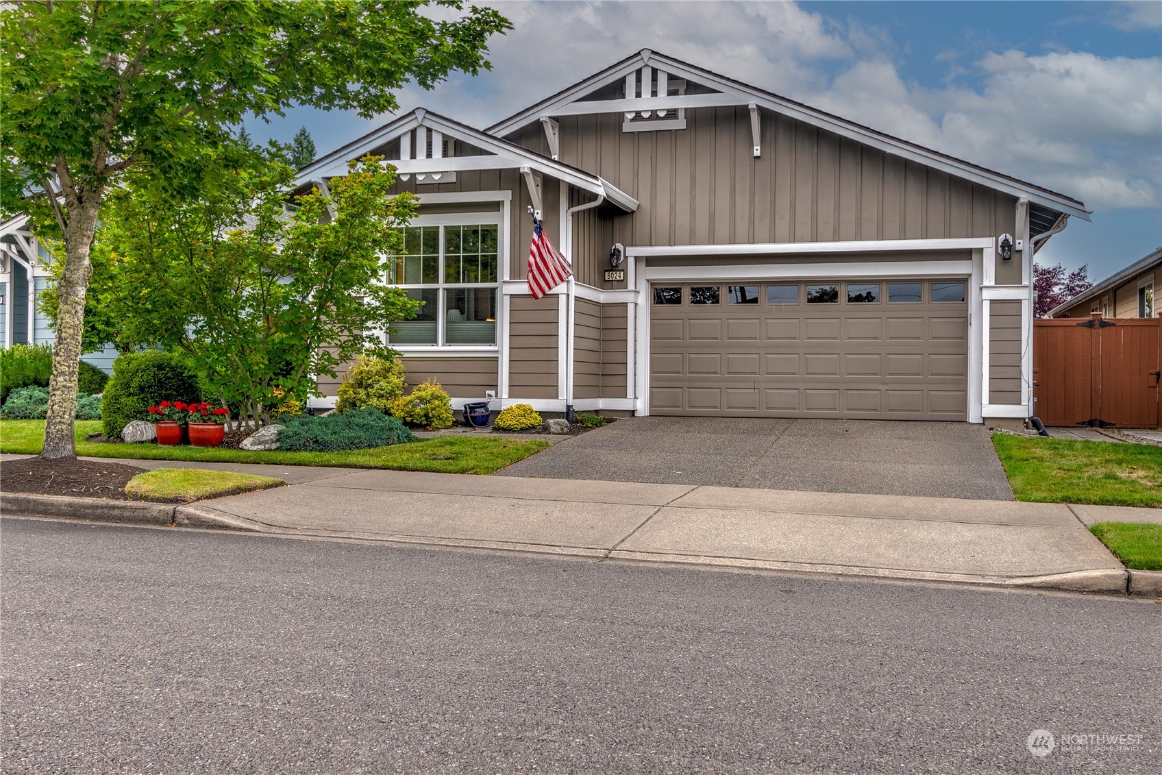 a front view of house with garage and yard