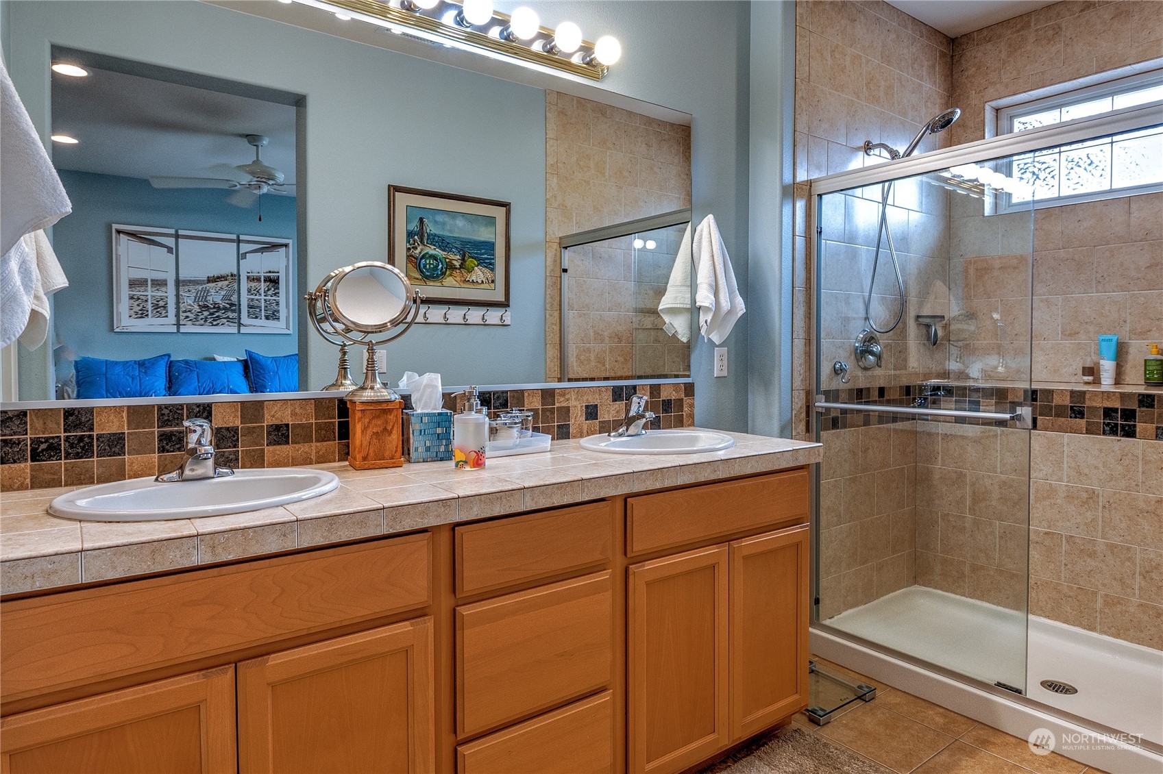 8024 Mercer Court Northeast Lacey, WA 98516 - Photo 14 of 30 a bathroom with a sink and a mirror
