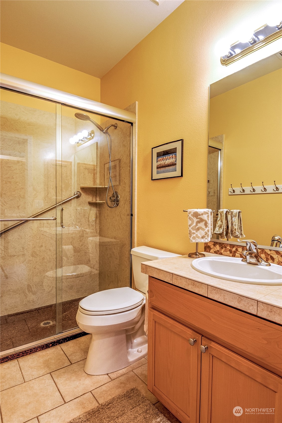 8024 Mercer Court Northeast Lacey, WA 98516 - Photo 19 of 30 a bathroom with a sink and a mirror