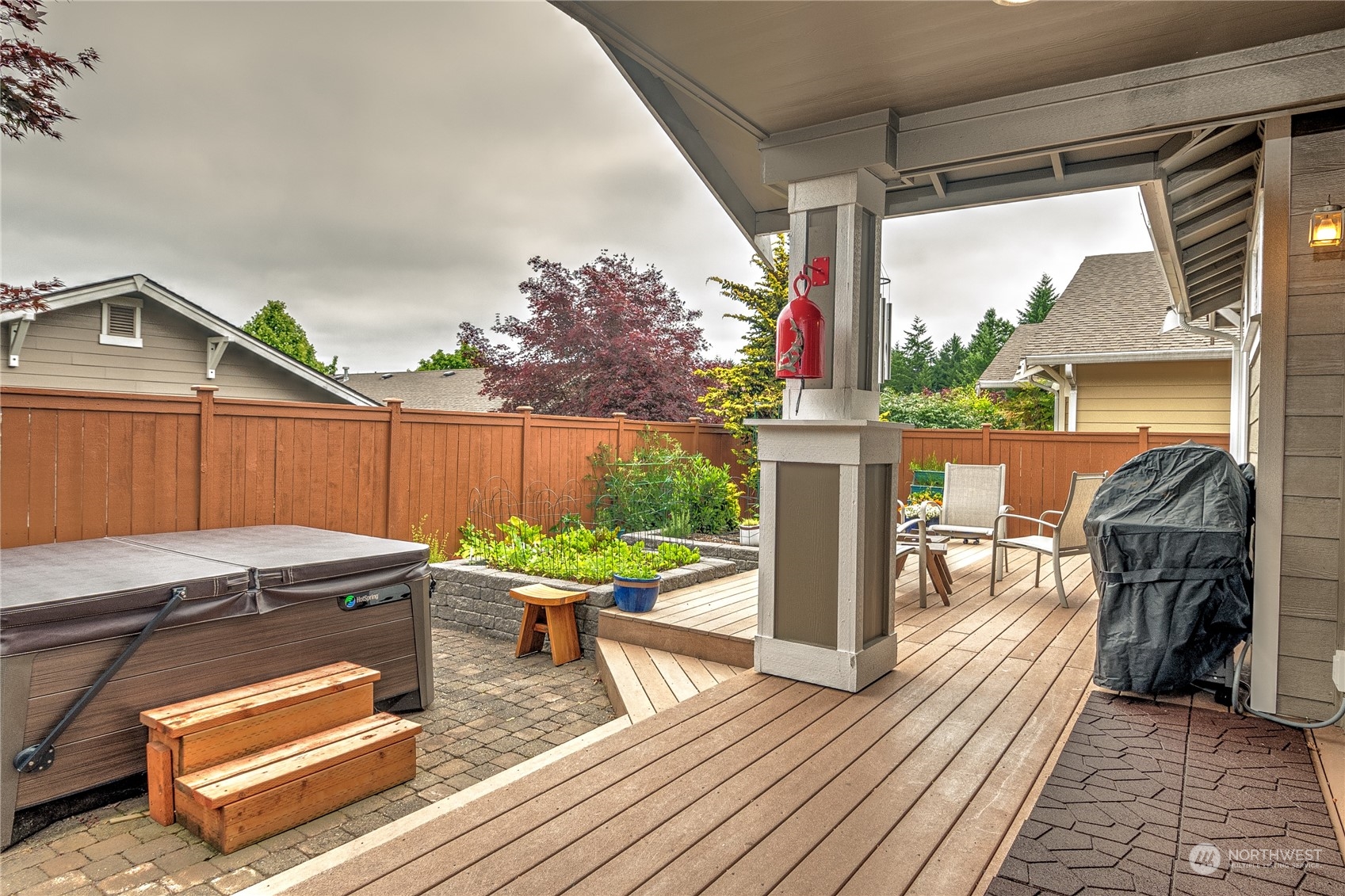 8024 Mercer Court Northeast Lacey, WA 98516 - Photo 21 of 30 a view of a patio with table and chairs potted plants with wooden floor