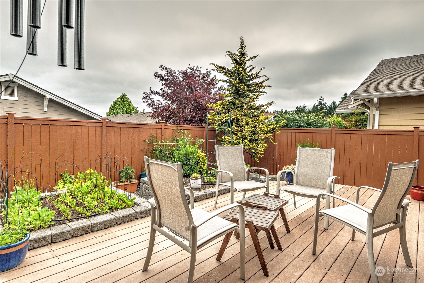 8024 Mercer Court Northeast Lacey, WA 98516 - Photo 22 of 30 a view of a chairs and table in patio with potted plants
