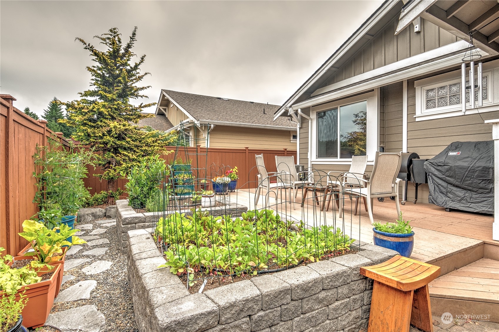 8024 Mercer Court Northeast Lacey, WA 98516 - Photo 25 of 30 a view of a backyard with sitting area