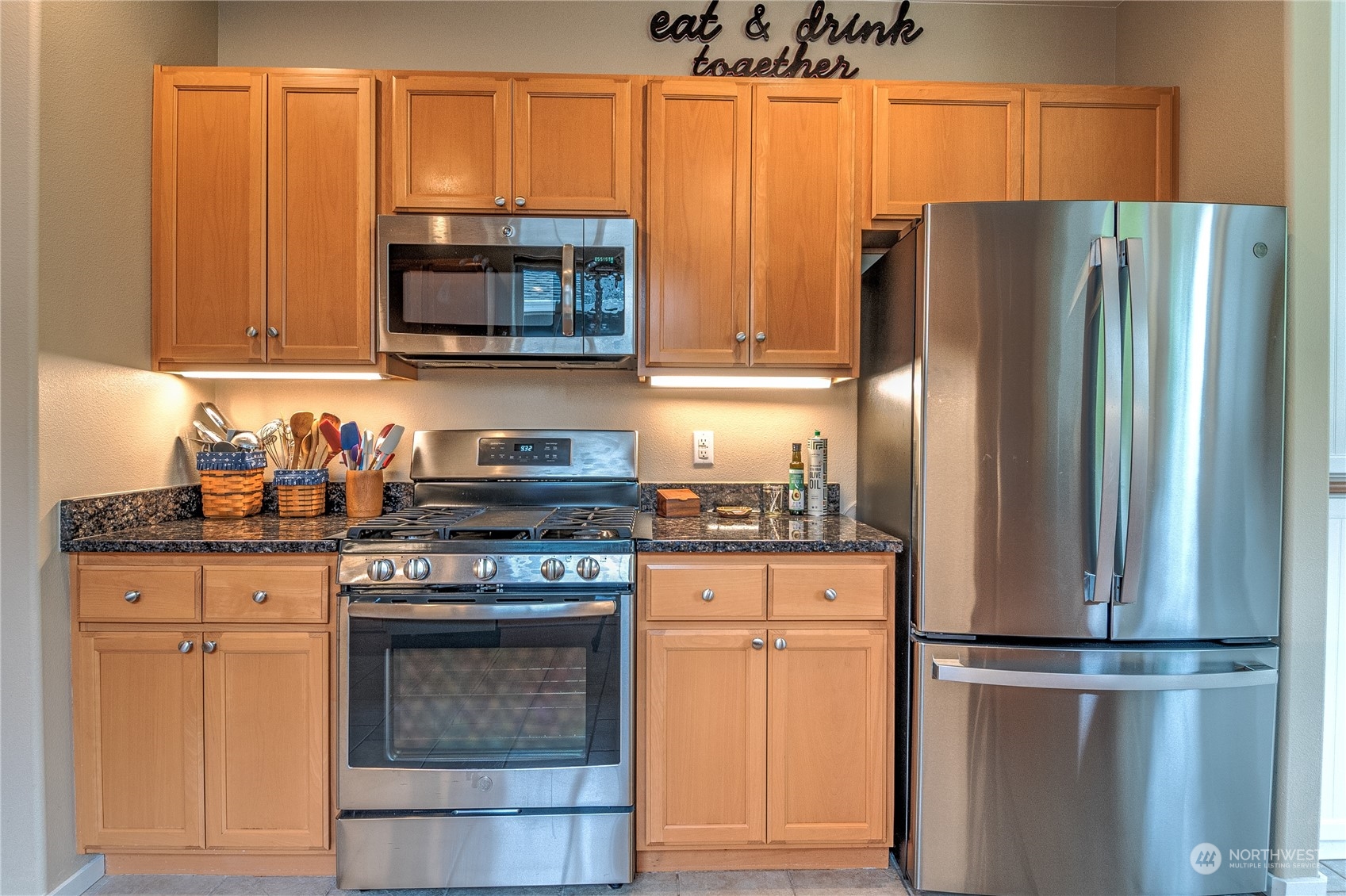 8024 Mercer Court Northeast Lacey, WA 98516 - Photo 7 of 30 a kitchen with stainless steel appliances granite countertop a refrigerator stove top oven and sink