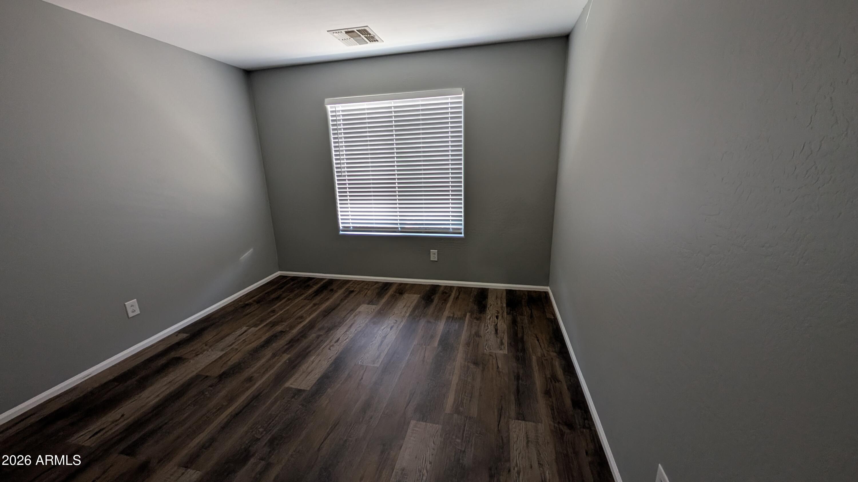 1377 East Pryor Road San Tan Valley, AZ 85140 - Photo 18 of 31 a view of wooden floor in a room