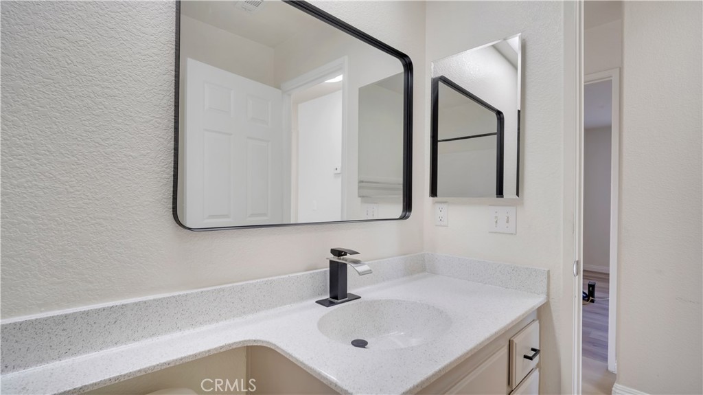 19364 Summerwind Trail Perris, CA 92570 - Photo 27 of 50 a bathroom with a sink and a mirror