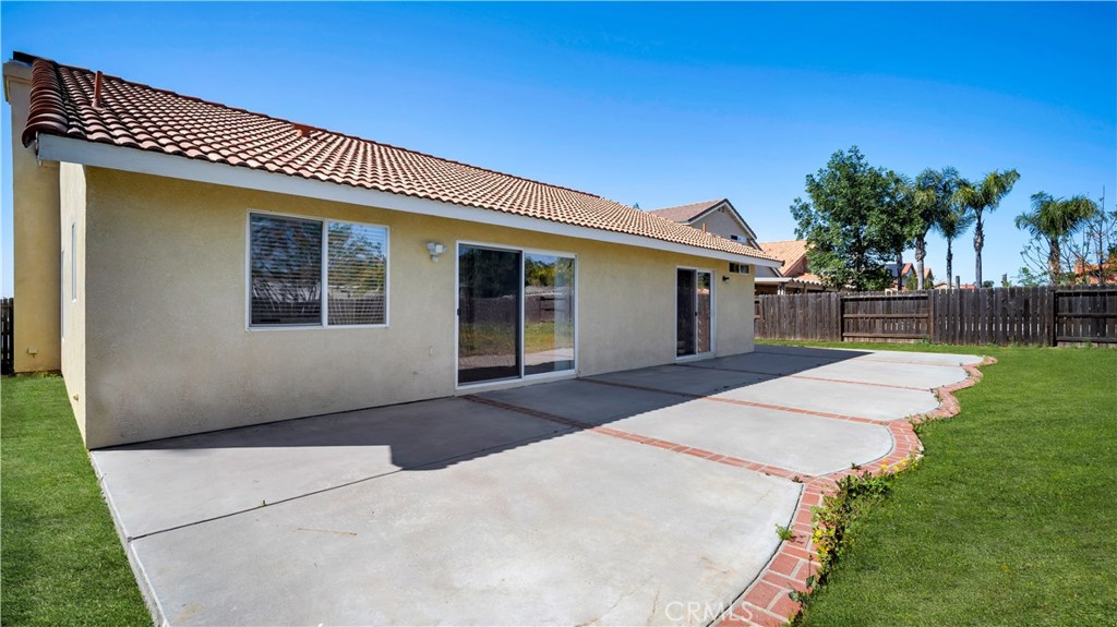19364 Summerwind Trail Perris, CA 92570 - Photo 41 of 50 a front view of a house with a yard