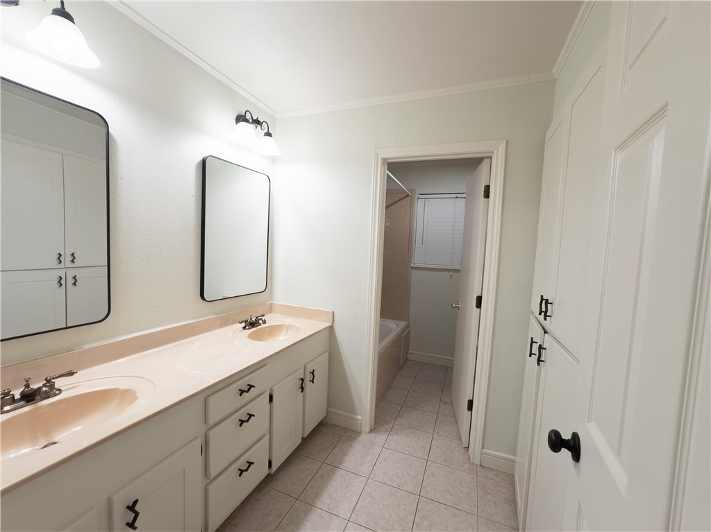 6702 Sahara Drive Corpus Christi, TX 78412 - Photo 15 of 30 a spacious bathroom with a double vanity sink mirror and double