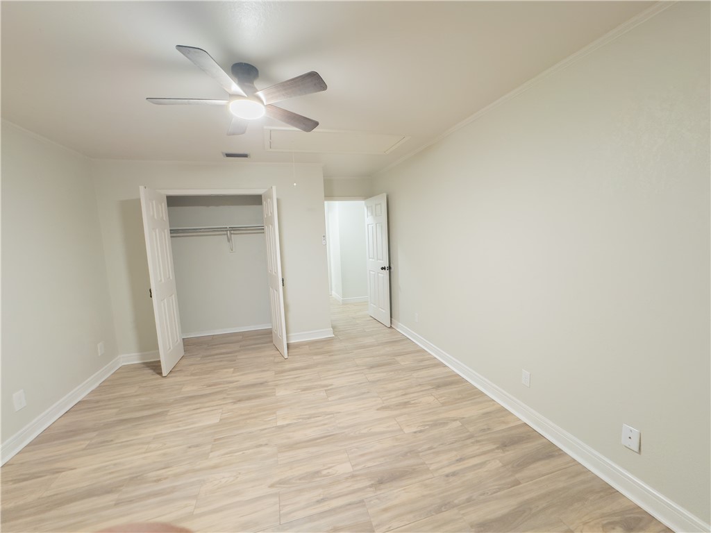 6702 Sahara Drive Corpus Christi, TX 78412 - Photo 17 of 30 a view of an empty room and wooden floor