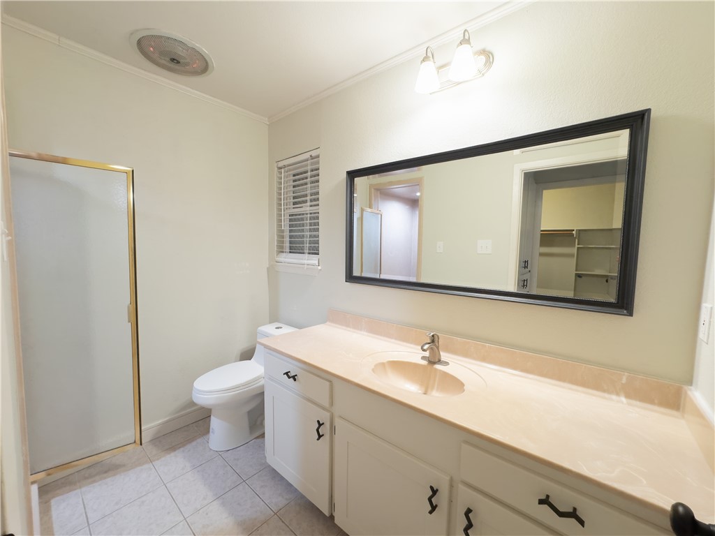 6702 Sahara Drive Corpus Christi, TX 78412 - Photo 21 of 30 a bathroom with a granite countertop sink mirror and toilet