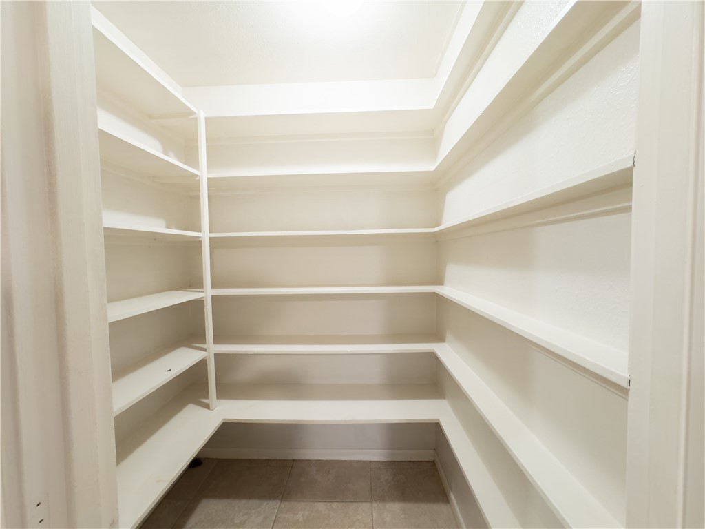 6702 Sahara Drive Corpus Christi, TX 78412 - Photo 8 of 30 a view of walk in closet with empty racks