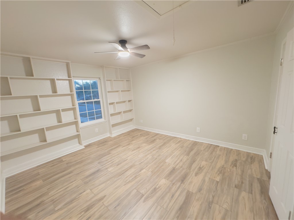 6702 Sahara Drive Corpus Christi, TX 78412 - Photo 9 of 30 wooden floor in an empty room with a window