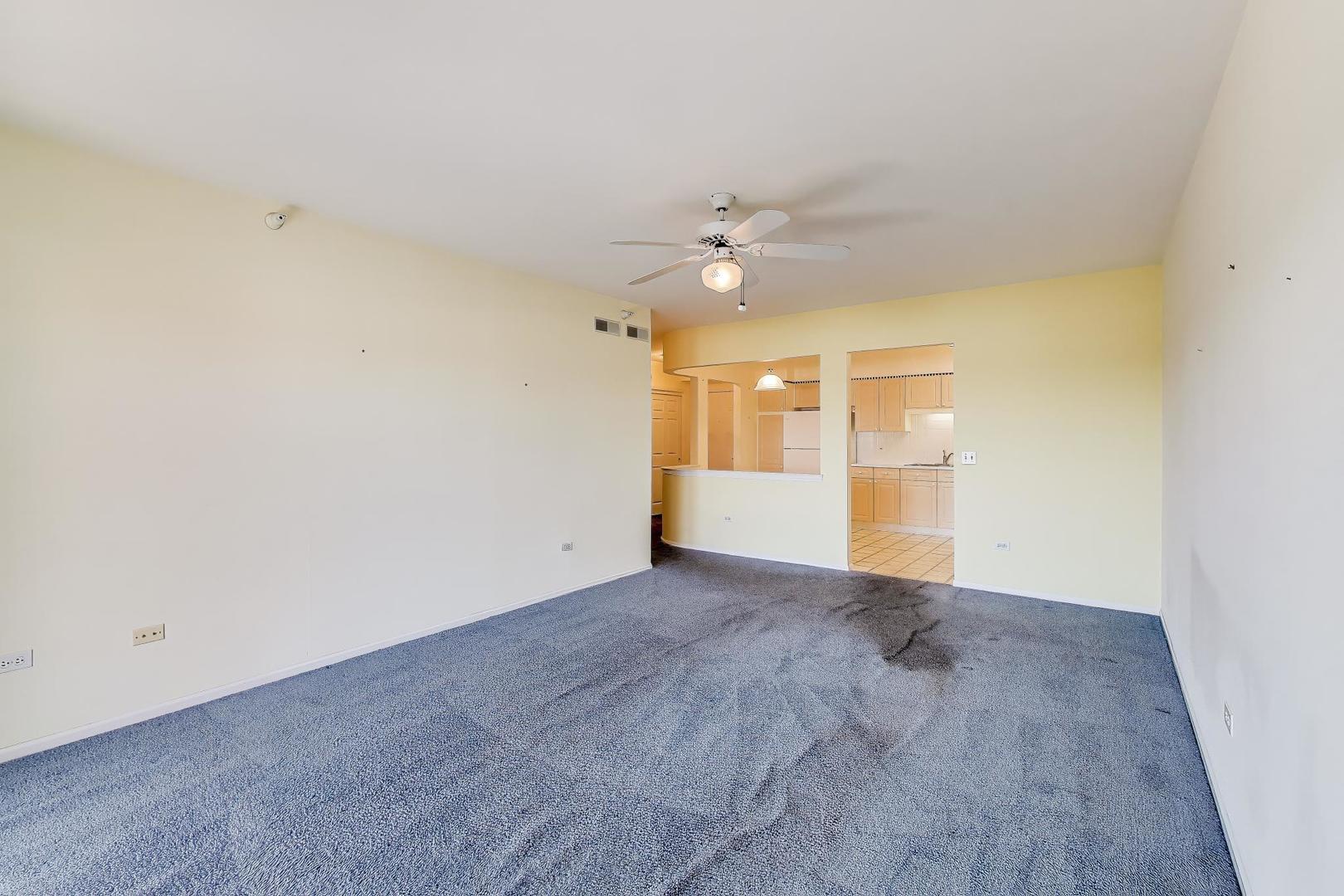 650 South River Road, Unit 812 Des Plaines, IL 60016 - Photo 15 of 25 an empty room with a empty space and a ceiling fan