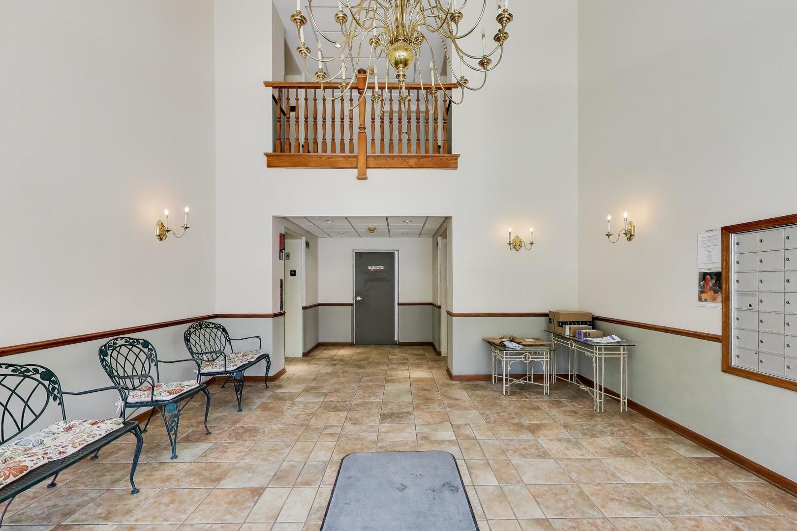 650 South River Road, Unit 812 Des Plaines, IL 60016 - Photo 5 of 25 a view of a hallway with seating area