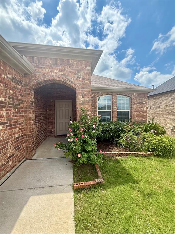 204 Flower Ridge Drive Fort Worth, TX 76108 - Photo 4 of 27 a front view of a house with a yard