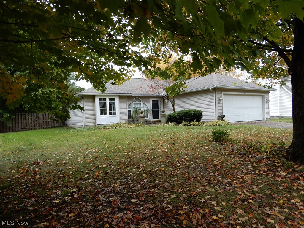 1168 Dock Road Madison, OH 44057 - Photo 3 of 35 Ranch-style house featuring a front lawn and a garage