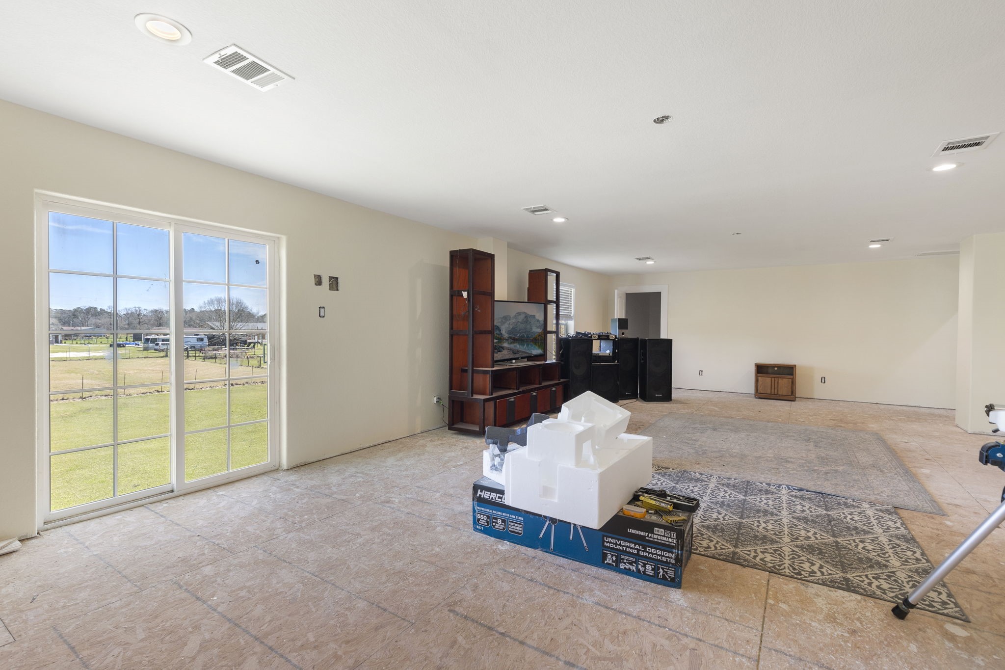 2464 North Walker Road Cleveland, TX 77328 - Photo 14 of 42 a living room with furniture and a table