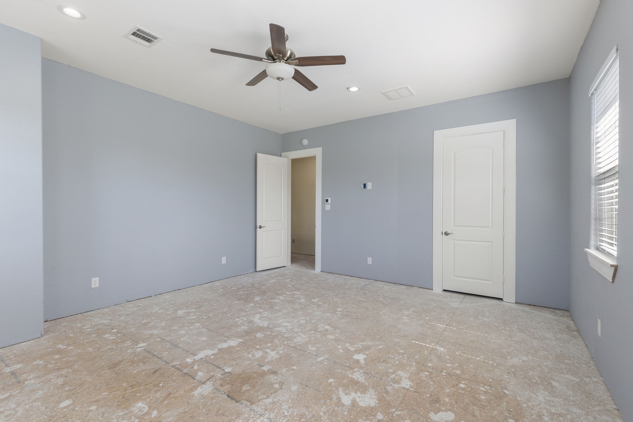 2464 North Walker Road Cleveland, TX 77328 - Photo 19 of 42 a view of a livingroom with a ceiling fan and window
