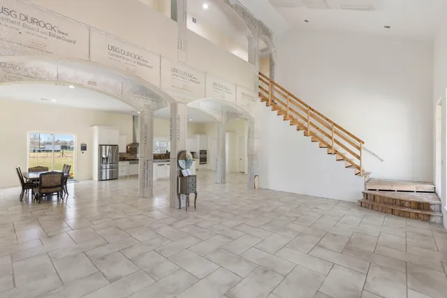 a view of a dining room with furniture and a potted plant