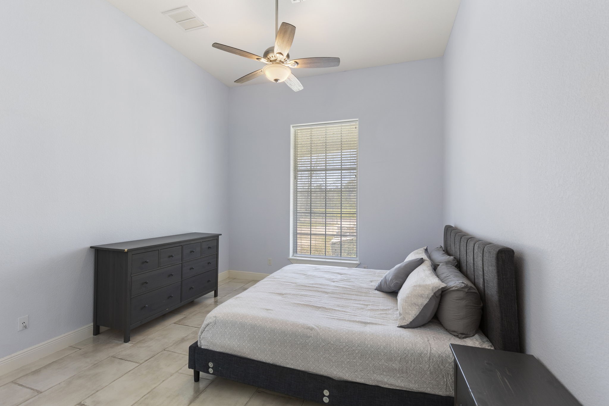 2464 North Walker Road Cleveland, TX 77328 - Photo 9 of 42 a bedroom with a bed and window