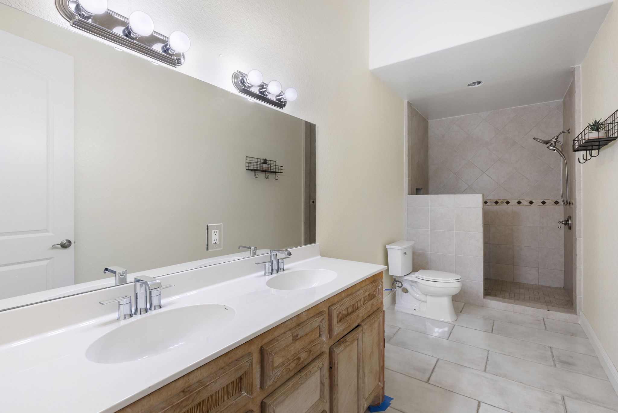 2464 North Walker Road Cleveland, TX 77328 - Photo 10 of 42 a bathroom with a sink toilet and shower