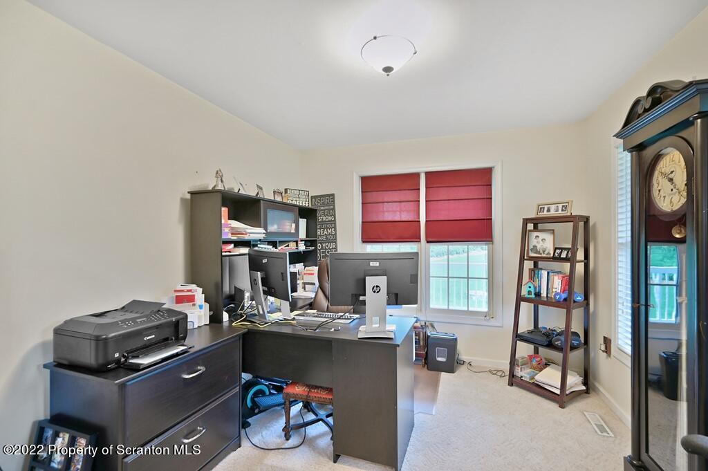 47 Wildernest Road Moscow, PA 18444 - Photo 19 of 40 a room with furniture and a bookshelf