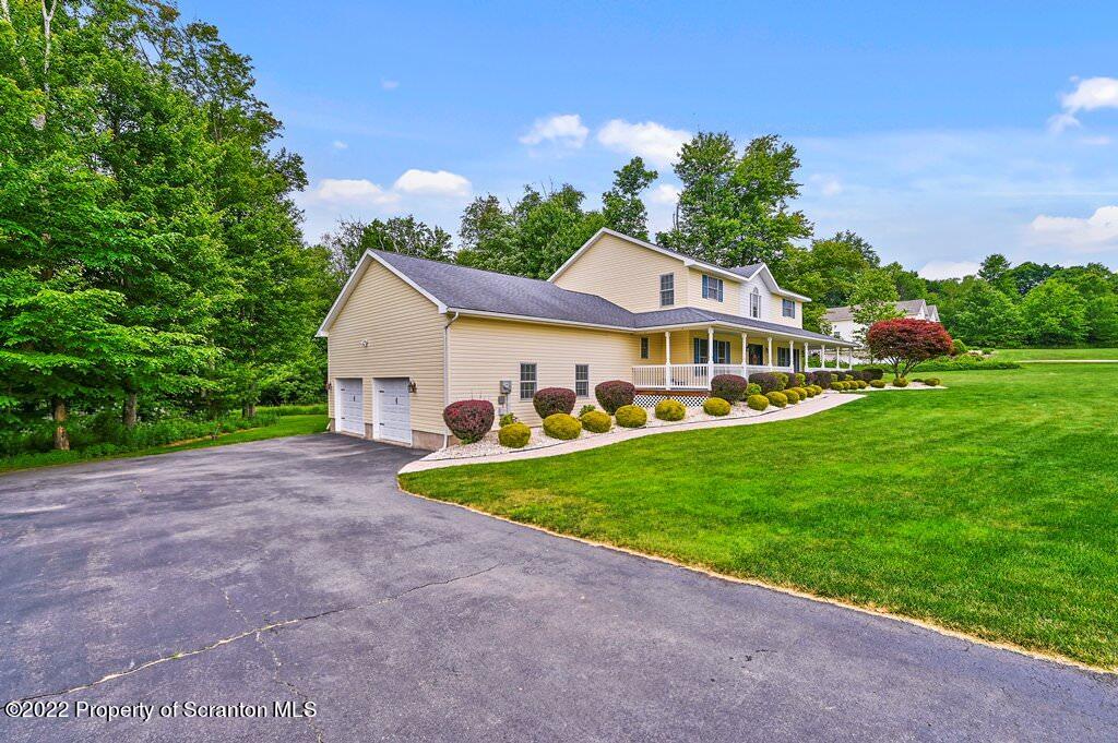 47 Wildernest Road Moscow, PA 18444 - Photo 2 of 40 a view of an house with backyard and garden