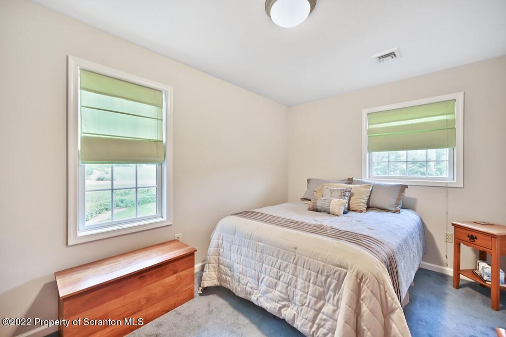 47 Wildernest Road Moscow, PA 18444 - Photo 29 of 40 a bedroom with a bed and a window
