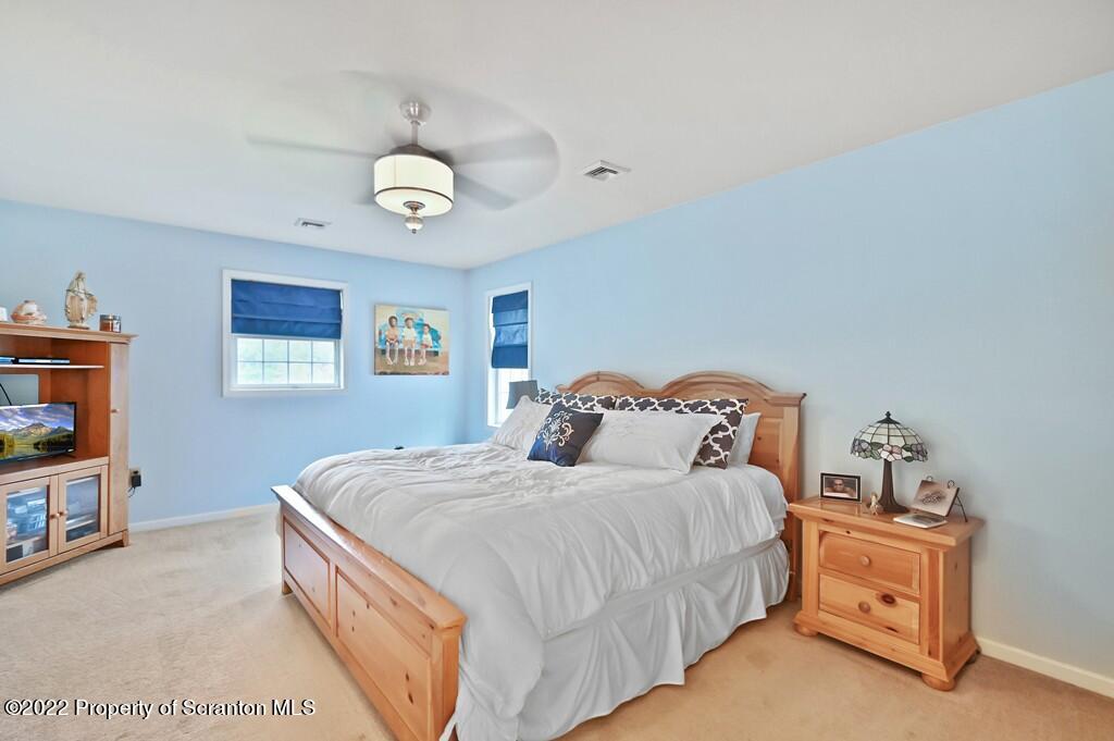 47 Wildernest Road Moscow, PA 18444 - Photo 33 of 40 a bedroom with a bed and a tv
