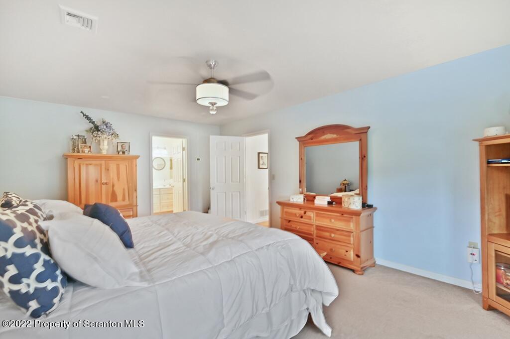 47 Wildernest Road Moscow, PA 18444 - Photo 35 of 40 a bedroom with a bed and dresser with mirror