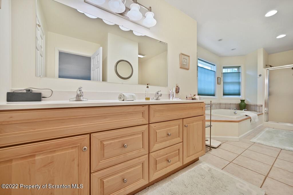 47 Wildernest Road Moscow, PA 18444 - Photo 36 of 40 a bathroom with a double vanity sink mirror and