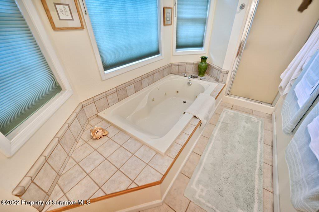 47 Wildernest Road Moscow, PA 18444 - Photo 38 of 40 a bathroom with a bathtub and shower