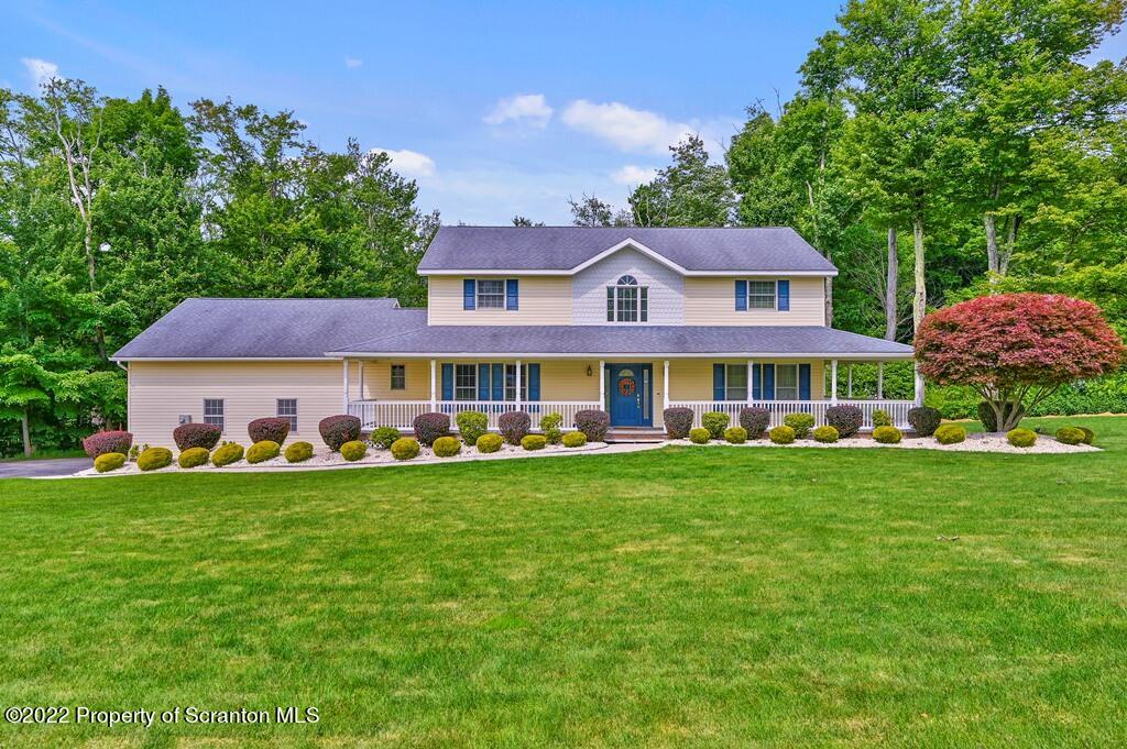47 Wildernest Road Moscow, PA 18444 - Photo 40 of 40 a front view of a house with a garden