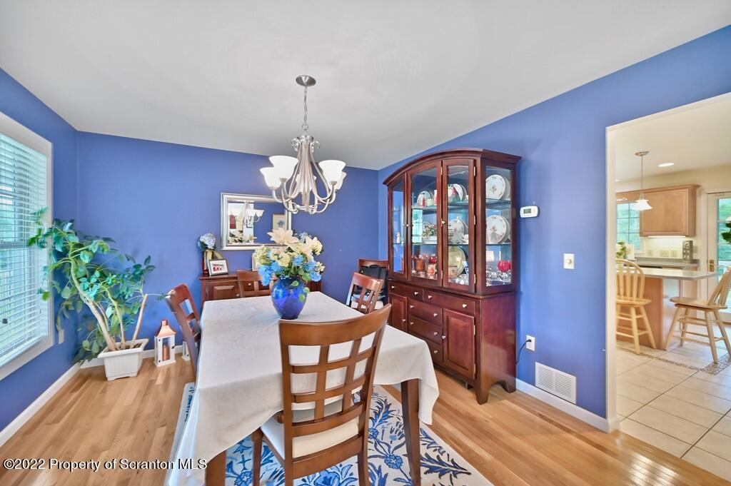 47 Wildernest Road Moscow, PA 18444 - Photo 9 of 40 a view of a dining room with furniture window and wooden floor