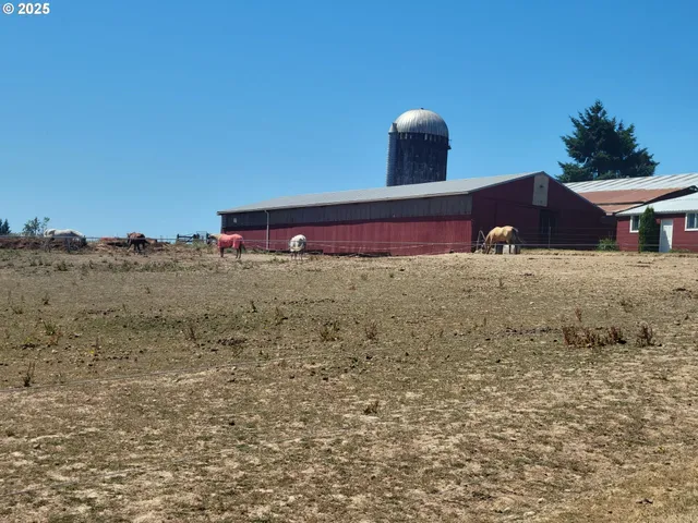a view of an house with backyard space and a lake view