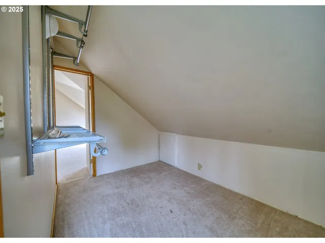 a view of an empty room with windows