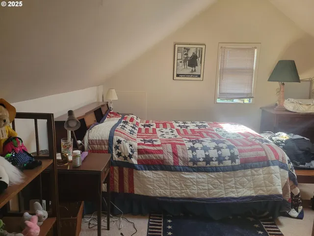 a view of a livingroom with furniture and closet