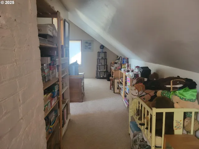 walk in closet with clothes and shoes