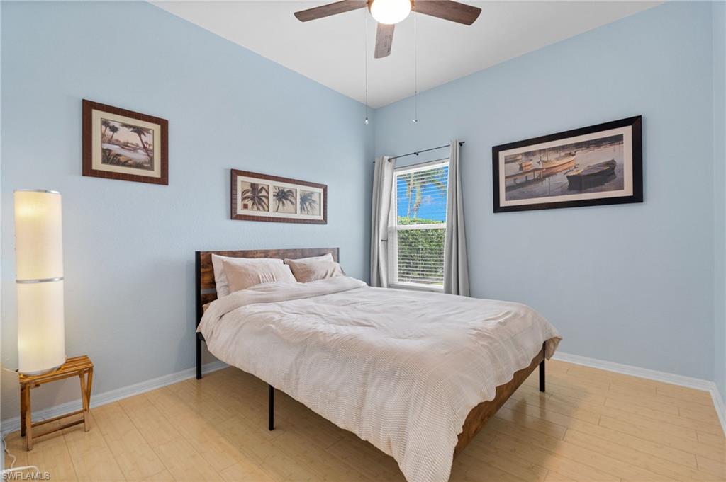 2780 Orange Grove Trail Naples, FL 34120 - Photo 17 of 29 Bedroom featuring light wood finished floors and ceiling fan