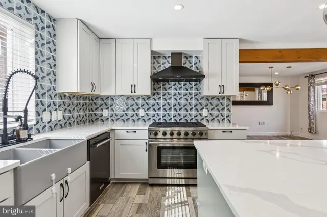 a kitchen with a sink stove and cabinets